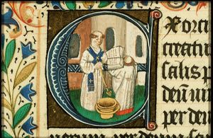 A priest blessing the water