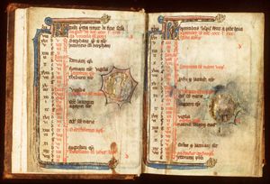August: a man binding sheaves