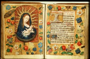 Madonna: Mary (standing) on the crescent, holding the Christ-child; Lactation
