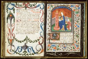 St. Barbara holding a palm, a tower beside her, with an angel
