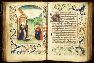 The Nativity: the adoration of the Christ-child by Mary and St. Joseph, who is holding a candle