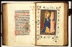 St. Barbara holding a palm, before the tower
