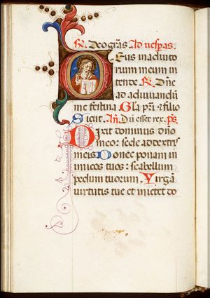 God the Father showing a book inscribed with an alpha and an omega