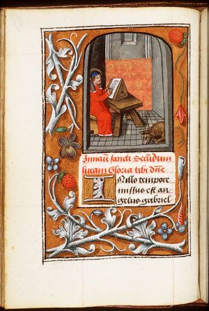 The Evangelist St. Luke writing, with his symbol the ox