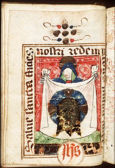 St. Veronica holding up the veil with the image of Christ (Vera Icon); IHS monogram