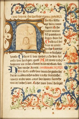 An angel holding an instrument of the Passion: cross