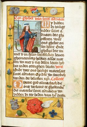St. Adrian of Nicomedia holding a sword and an anvil, with a lion