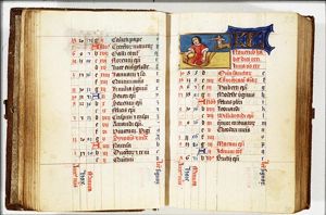 November: a man slaughtering a pig; Sagittarius