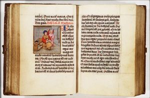 The Evangelist St. Matthew writing, with his symbol the angel