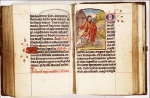 St. Roch of Montpellier holding a staff, with a dog with a loaf in its mouth, showing the plague-spot inside his thigh