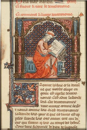 Moses writing the Book of Deuteronomy