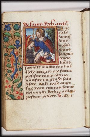 St. Roch of Montpellier holding a staff, with a dog with a loaf in its mouth, and an angel healing the plague-spot inside his thigh