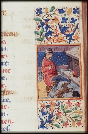 February: a man warming himself at a fire
