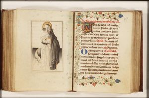 St. Antony Abbot of Egypt holding a book, a bell and a staff, with a pig