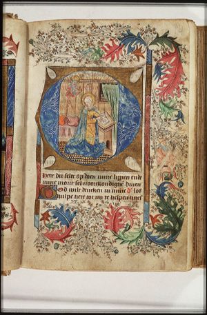 God the Father holding an orb with a cross; Mary praying (initial facing a miniature of the Annunciation)