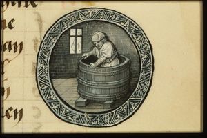 September: a man treading grapes