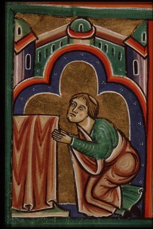 A monk prays to Mary