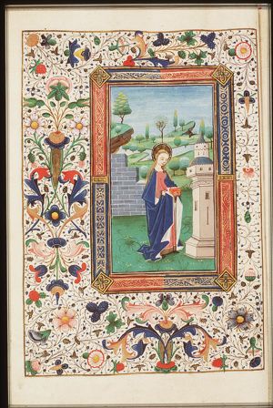 St. Barbara holding a book, before the tower