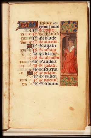 February: a man warming himself at a fire