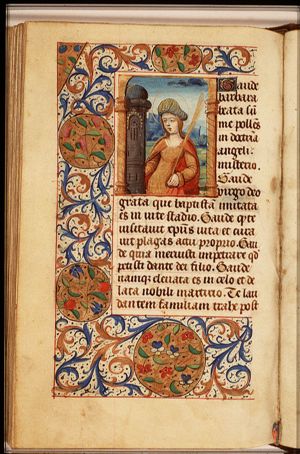 St. Barbara holding a palm, a tower beside her