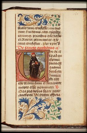 St. Antony Abbot of Egypt standing on flames, holding a bell, a staff and a book, with a pig