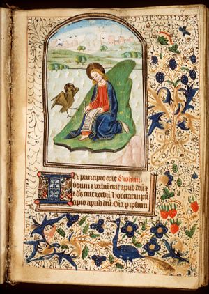 The Evangelist St. John writing on the isle of Patmos, with his symbol the eagle