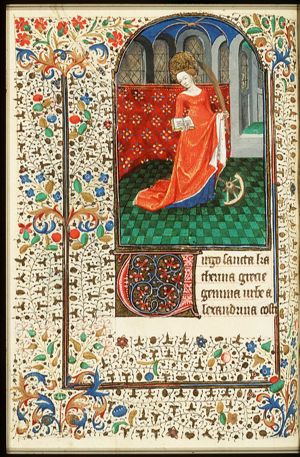 St. Catherine of Alexandria holding a book and a palm, with a wheel at her feet