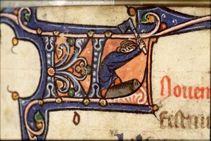 November: a man slaughtering a pig