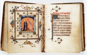 St. Agnes of Rome holding a palm, a lamb at her feet, and St. Barbara holding a palm and a tower