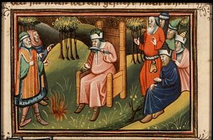 The prophet Ezekiel cuts off his hair and beard and burns it