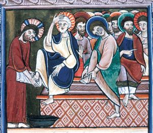 with the towel hanging from his girdle Christ wipes Peter's foot above a laver; Peter holds his left hand down and touches his head with his right; on the bench to Peter's left, John wipes his foot and another apostle holds his hand in front of his chest in a speaking gesture; between Peter and John, one of the others holds his hand in front of his chest with the palm in front view.