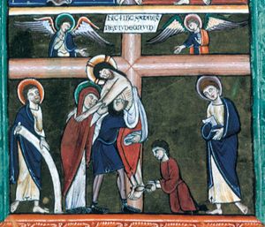 Nicodemus and Joseph of Arimathea take down Christ from the cross; one of them pulls the nail from Christ's foot, the other one supports the body of Christ, sinking to it's right side, putting both arms, covered with a cloth around it; both of Christ's arms, stretched forward, rest on Mary' shoulders, while she holds his left arm with both hands forward; John with a book in his covered hand on the right; on the left a saint holding a scroll; two angels stretching one hand down, holding the other in front of their chest, with the palm in front view, on the arms of the cross to which also the superscription is affixed.