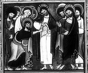 with his left hand covered, Thomas touches with his out-stretched right hand the wound in Christ's side, which Christ shows him by pulling up his shirt; from the other apostles, looking at Christ and Thomas, one holds a book in his covered left and his right hand in front of his chest in a gesture of speech; a second one stretches his right hand forward.