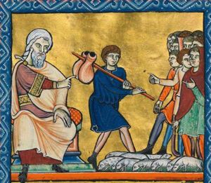 Jacob sits on the left with his left hand on his knee, his right hand pointing sidewards to his left: Joseph walking to his brothers, carrying a staff on his shoulder with a bag over it; his brothers see him coming and make various gestures: one holds his left hand in front of his chest pointing, one stretches his right hand forward in pointing and one holds his right hand downwards with the palm in front view; two are wearing their hoods over their head; one holds a shepherd's crook; a herd of very small sheep.
