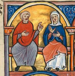 Elimelech, making a speaking gesture with his left hand sideward, and holding his left hand in front of his chest, is seated next to Naomi who holds her hands in front of her chest, the palm of her right hand in front view; architectural setting.