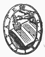 A hand holding a ruling-comb
