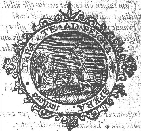 A man swings a sickle to cut a twig from a plant; a scythe on the ground; a cornfield; decorated frame
