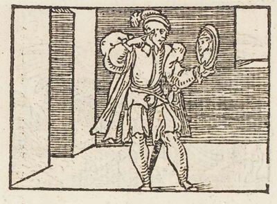 A man looking at his face in a hand mirror