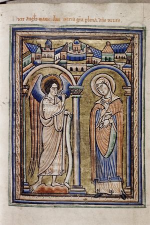 Mary, standing to the right, with a book in her left hand and holding her right hand in front of her chest with the palm in front view, is visited by Gabriel, who holds a scroll in his left hand and makes a speaking gesture with his right hand forward; architectural setting.