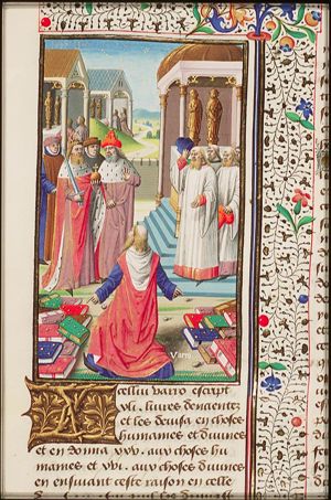 Varro pointing at his "Antiquitates" (Antiquities), divided in Human Matters and Divine Matters; he is kneeling before an emperor and pontifex, counsellors, priests; temples with praying Romans