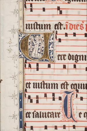 Kneeling man focussed on the Holy Mass in the initial
