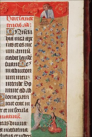 Man strewing flowers; woman gathering flowers